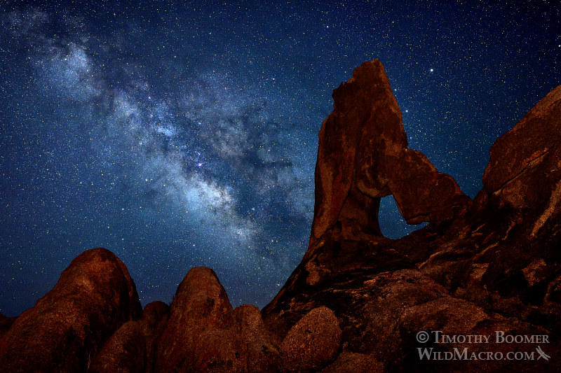 The Milky Way galaxy rises over lady boot arch at Alabama Hills Recreation Area.  The planet Saturn is the bright point of light to the right of the top of the arch.  Lone Pine, CA.  Stock Photo ID=SCE0121